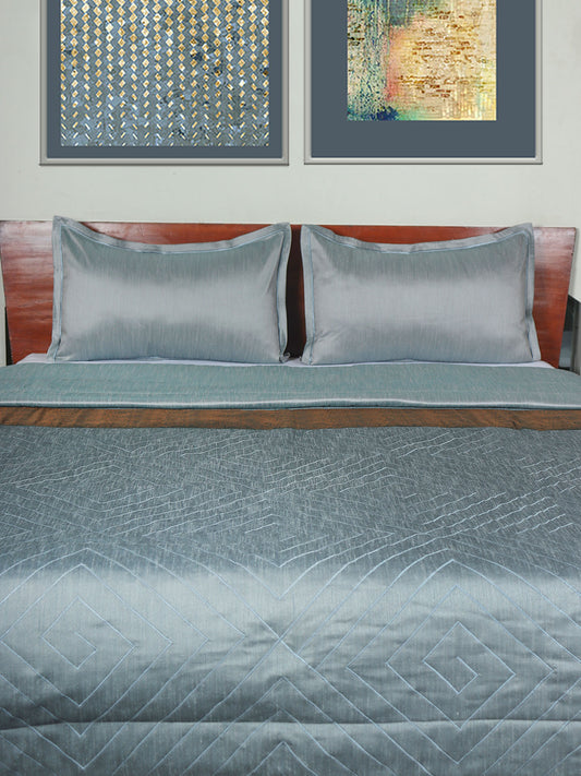 Blue colored bed quilt /comforter with patchwork and embroidery along with 2 matching pillow covers made from polyester front and cotton backed quilt for king size double bed