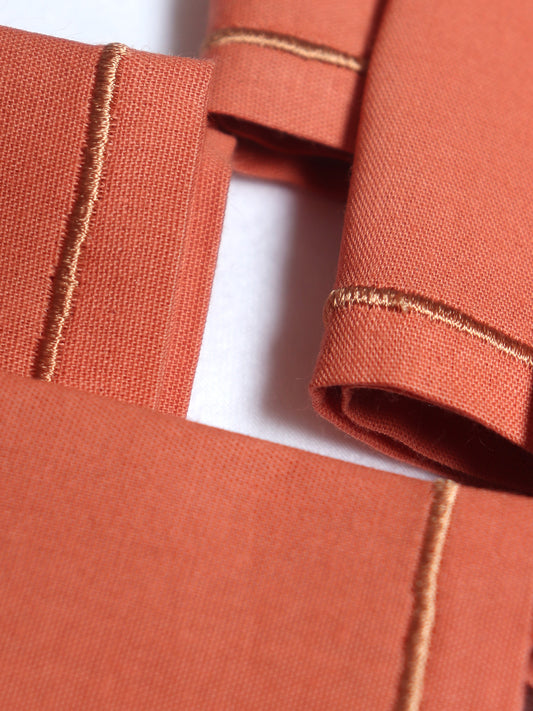 closeup of embroidered set of 6 dinner napkins in cark coral color - 16x16 inch