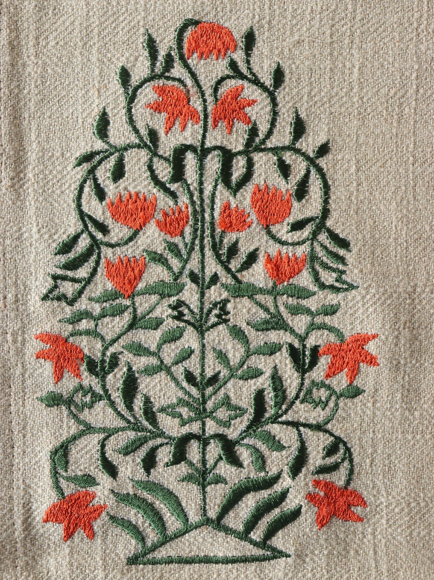closeup of floral embroidered dining table mats in beige and rust color combo - 13x19 inch