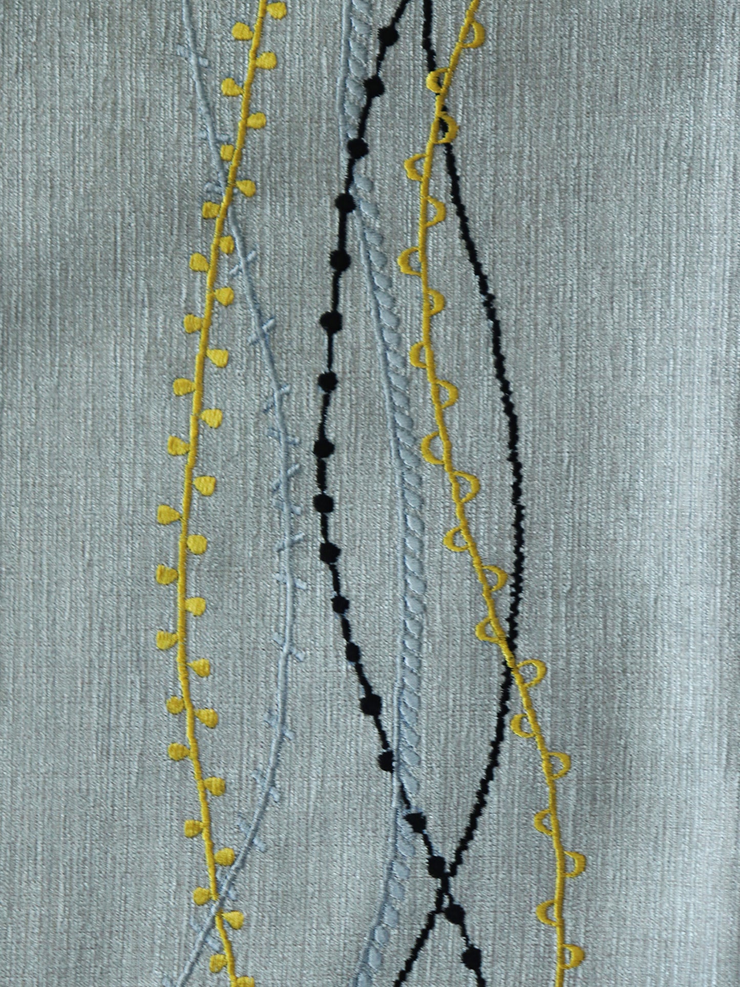 closeup of embroidered dinner placemats in grey color - 13x19 inch