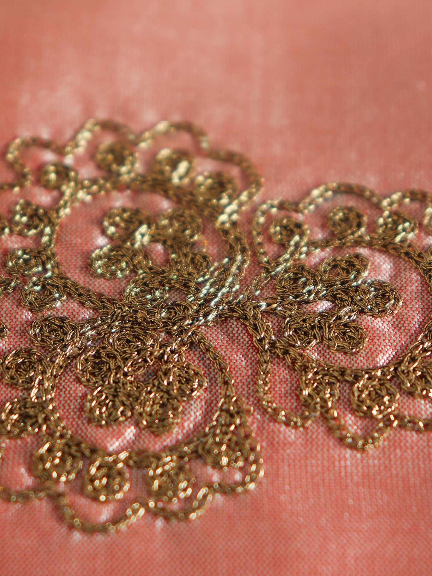 closeup of motif hand embroidery on peach table runner for 6 seater table runner - 12x84 inch
