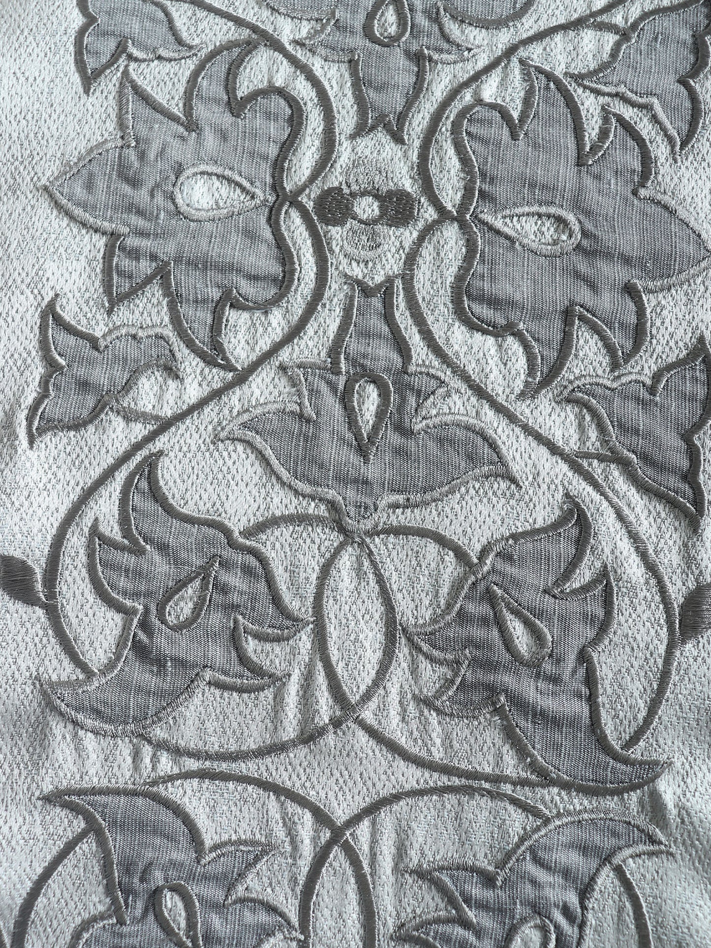 closeup of floral embroidery with hand crafted applique design on gray table runner - 12x84 inch