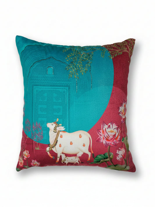 Decorative pillow with a cow and floral design on a white background