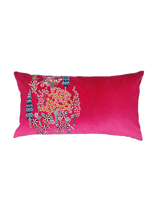 Pink pillow with floral embroidery on a light gray background