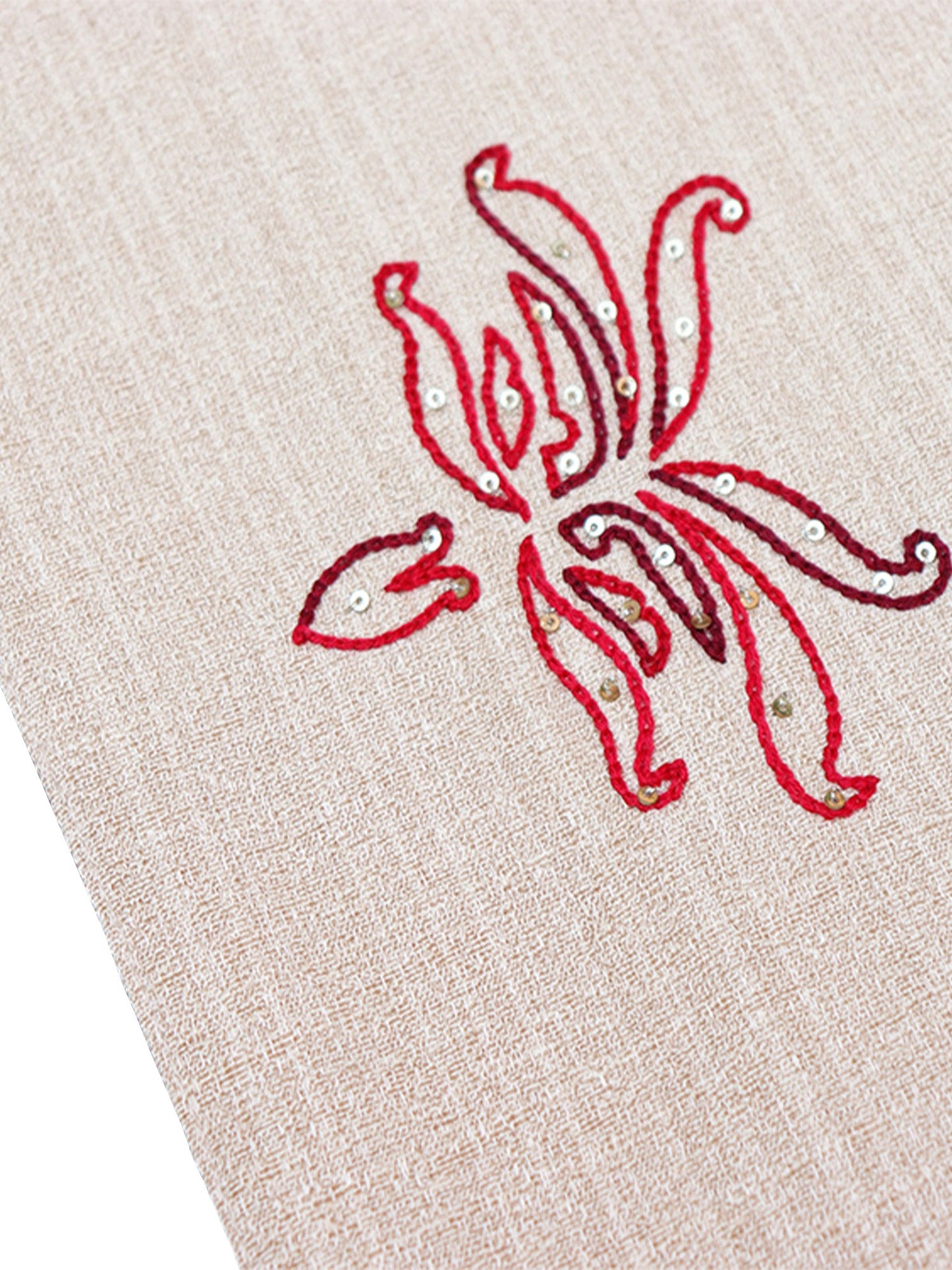 closeup of hand embroidery on white table runner with floral pattern for 6 seater table - 12x84 inches