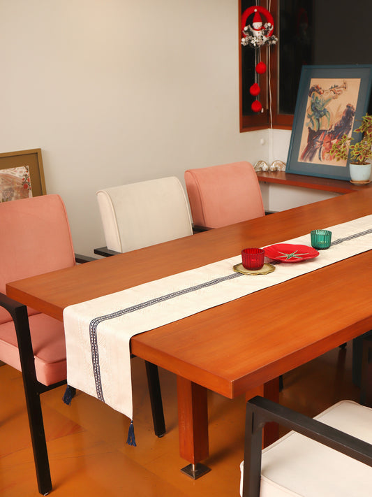 grey colored embroidered table runner with tassels on corners for 6 seater table - 52x84 inches.