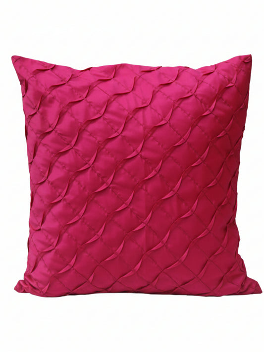 A square magenta pink throw pillow with a textured, pleated diamond pattern, shown against a plain white background.