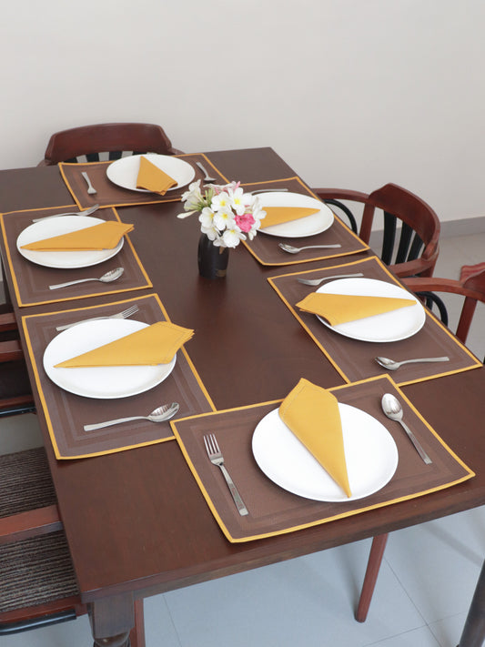 Solid Dinner Table Mats and Table Napkin | Flat Piping | Set of 6 | Brown and Mustard | Polyester | Cotton | 12 Inch x 18 Inch | 16 Inch x 16 Inch