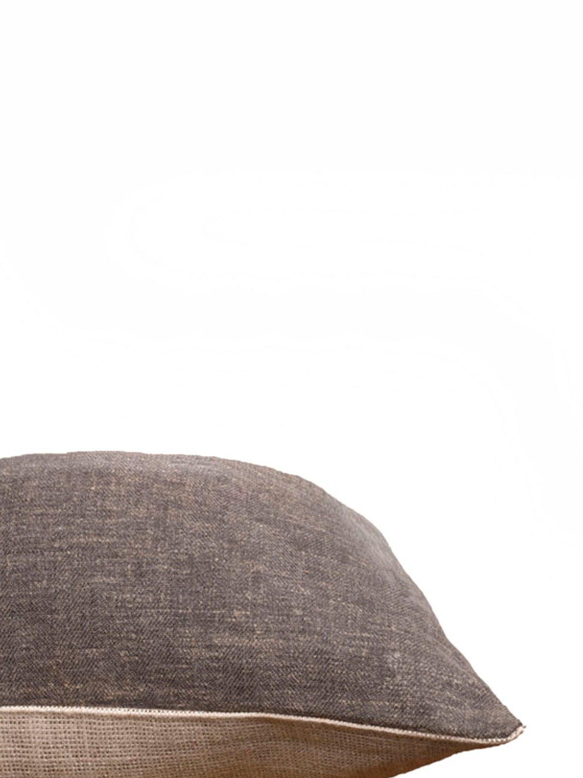 A close-up of a textured gray throw pillow with a visible beige underside, set against a solid white background.