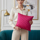A square magenta pink throw pillow with a textured, pleated diamond pattern, shown against a plain white background.