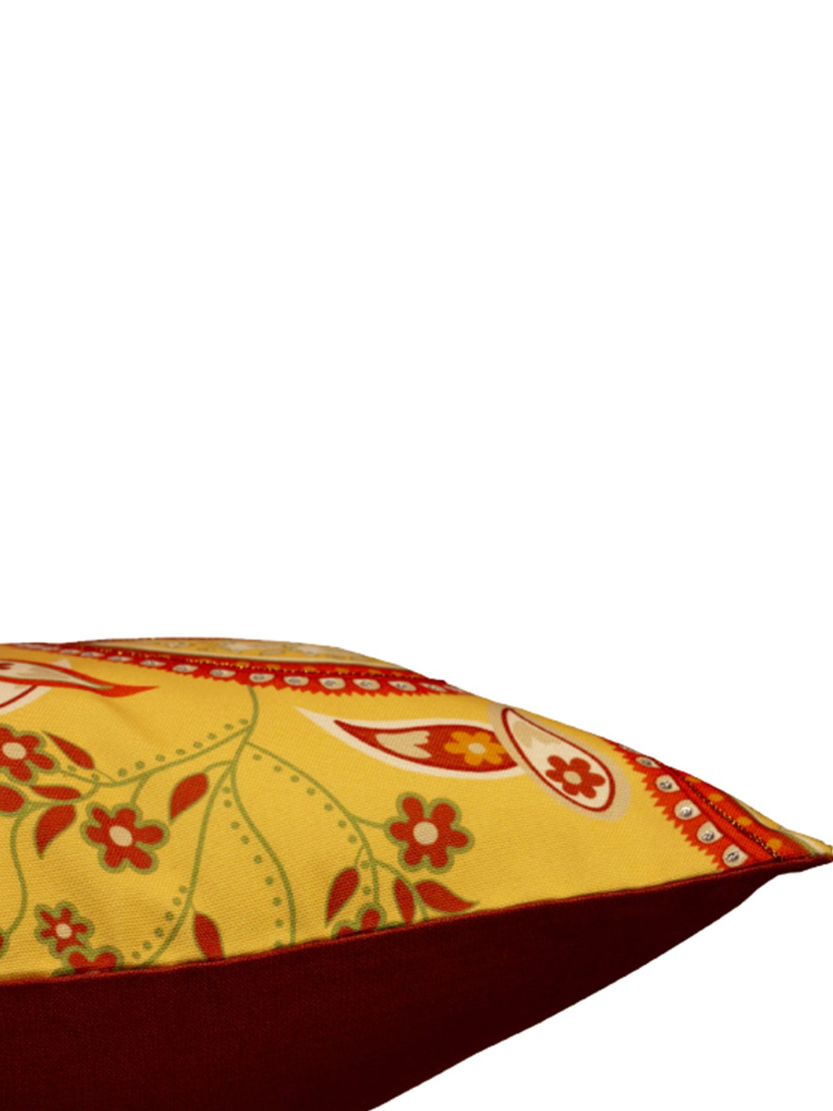 A close-up of a decorative throw pillow featuring a yellow and red paisley pattern with a solid dark red underside, shown against a plain white background.
