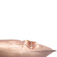 A close-up of a blush pink pillow with pleated fabric detailing, shown against a solid white background.