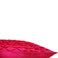 A close-up of a bright pink textured throw pillow with a geometric diamond-quilted pattern on a solid white background.