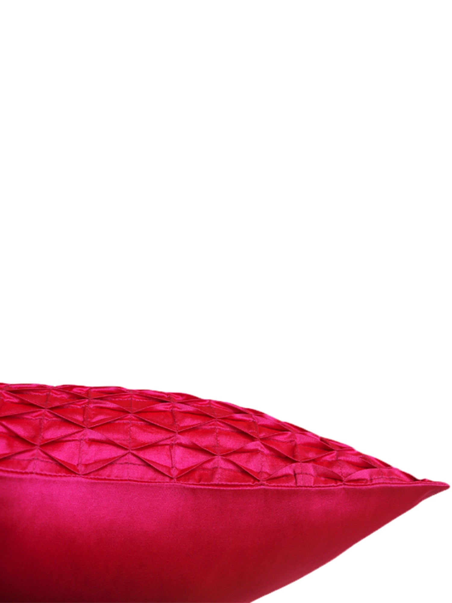 A close-up of a bright pink textured throw pillow with a geometric diamond-quilted pattern on a solid white background.