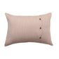 A rectangular beige throw pillow with a vertical line of three small metallic buttons on the right side, shown against a plain white background.