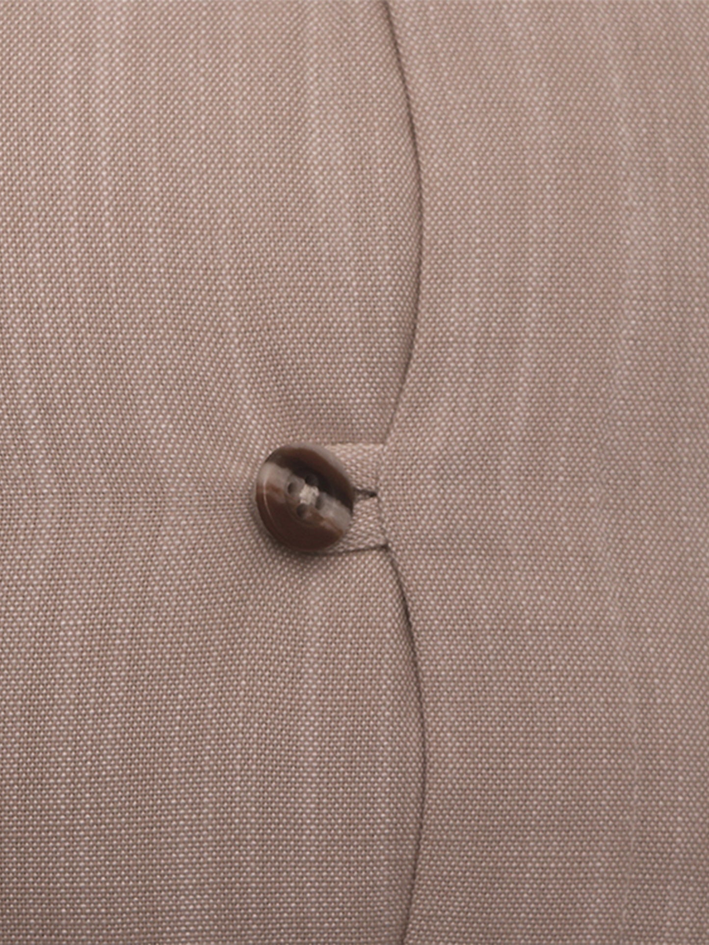 Close-up of a textured fabric surface in a warm taupe-beige color with a single dark brown button near the center.