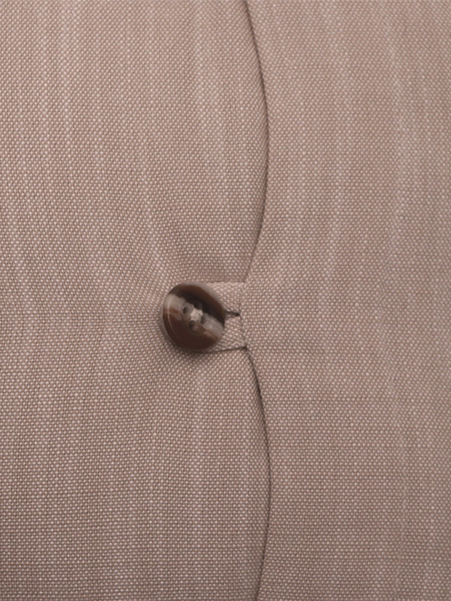 Close-up of a textured fabric surface in a warm taupe-beige color with a single dark brown button near the center.