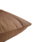 A close-up of a textured brown throw pillow corner on a solid white background.