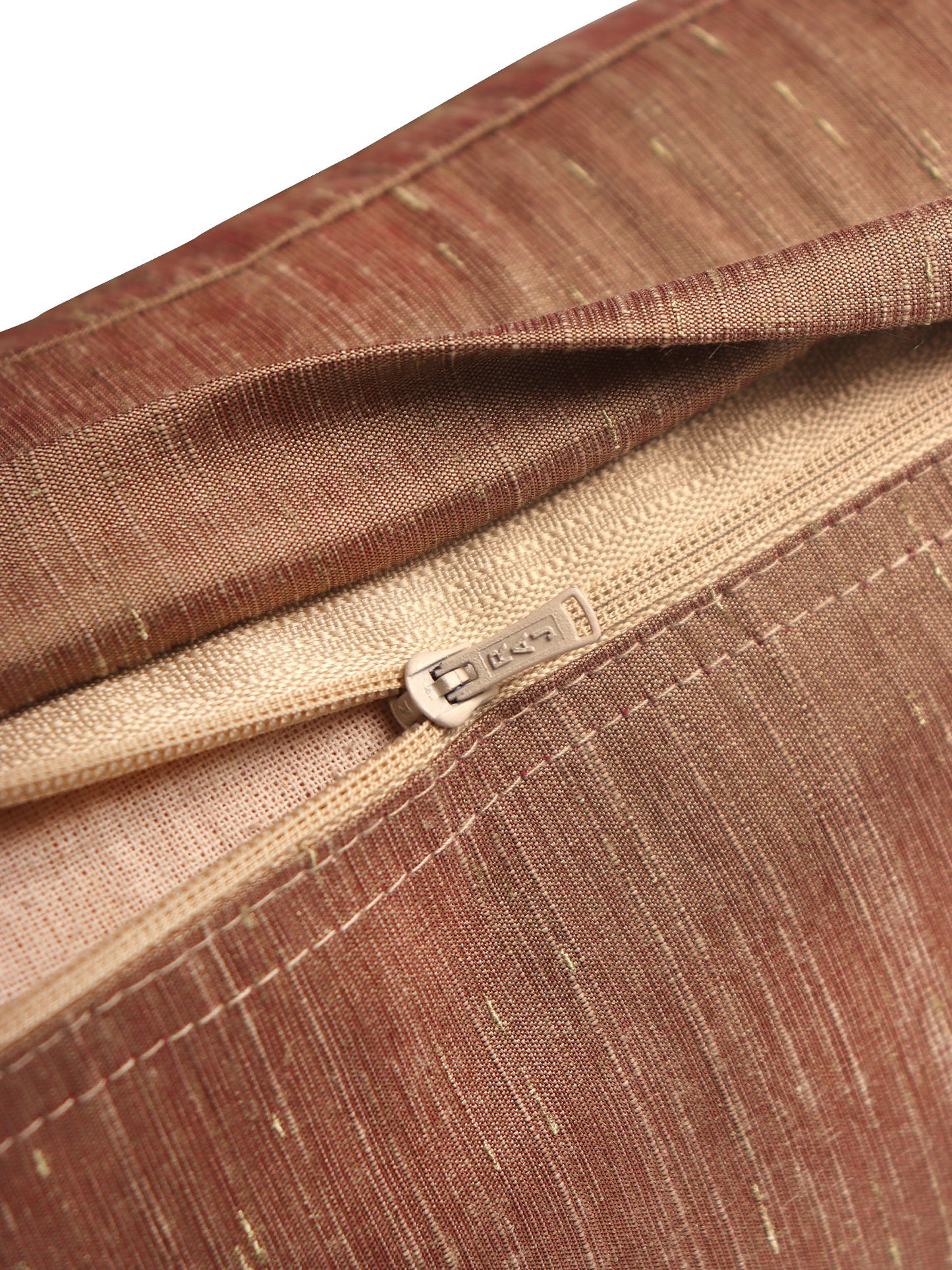 Close-up of a brown and beige striped fabric zipper pouch with a silver metal zipper pull, showing the texture of the woven material.