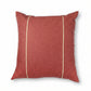 A square terracotta red throw pillow with two vertical gold stripes, shown with dimension arrows and labels indicating a 24 by 24 inch size.