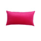 A rectangular lumbar throw pillow in a vibrant hot pink velvet fabric, shown against a plain white background.