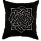 A square black throw pillow featuring a large silver Celtic knot design embroidered in the center, set against a plain white background.