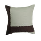 A square decorative throw pillow featuring a light sage green textured body with dark brown fringed trim on two sides, shown against a plain white background.