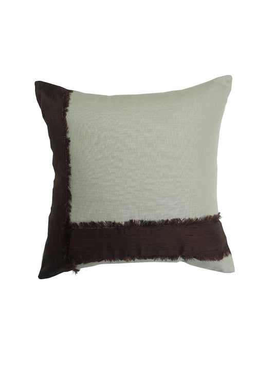 A square decorative throw pillow featuring a light sage green textured body with dark brown fringed trim on two sides, shown against a plain white background.