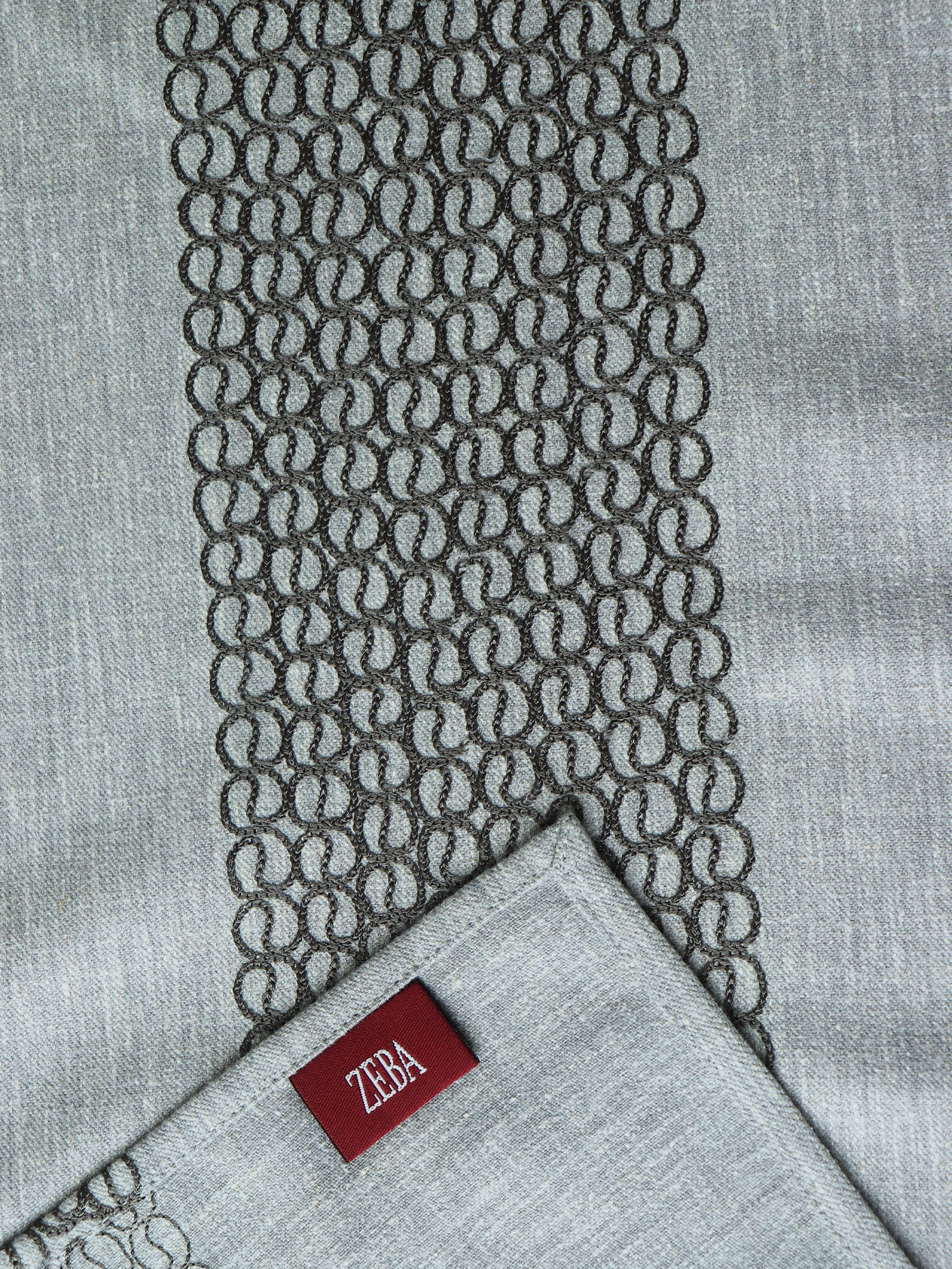 closeup of gray colored embroidery on table runner for 6 seater table - 52x84 inches.